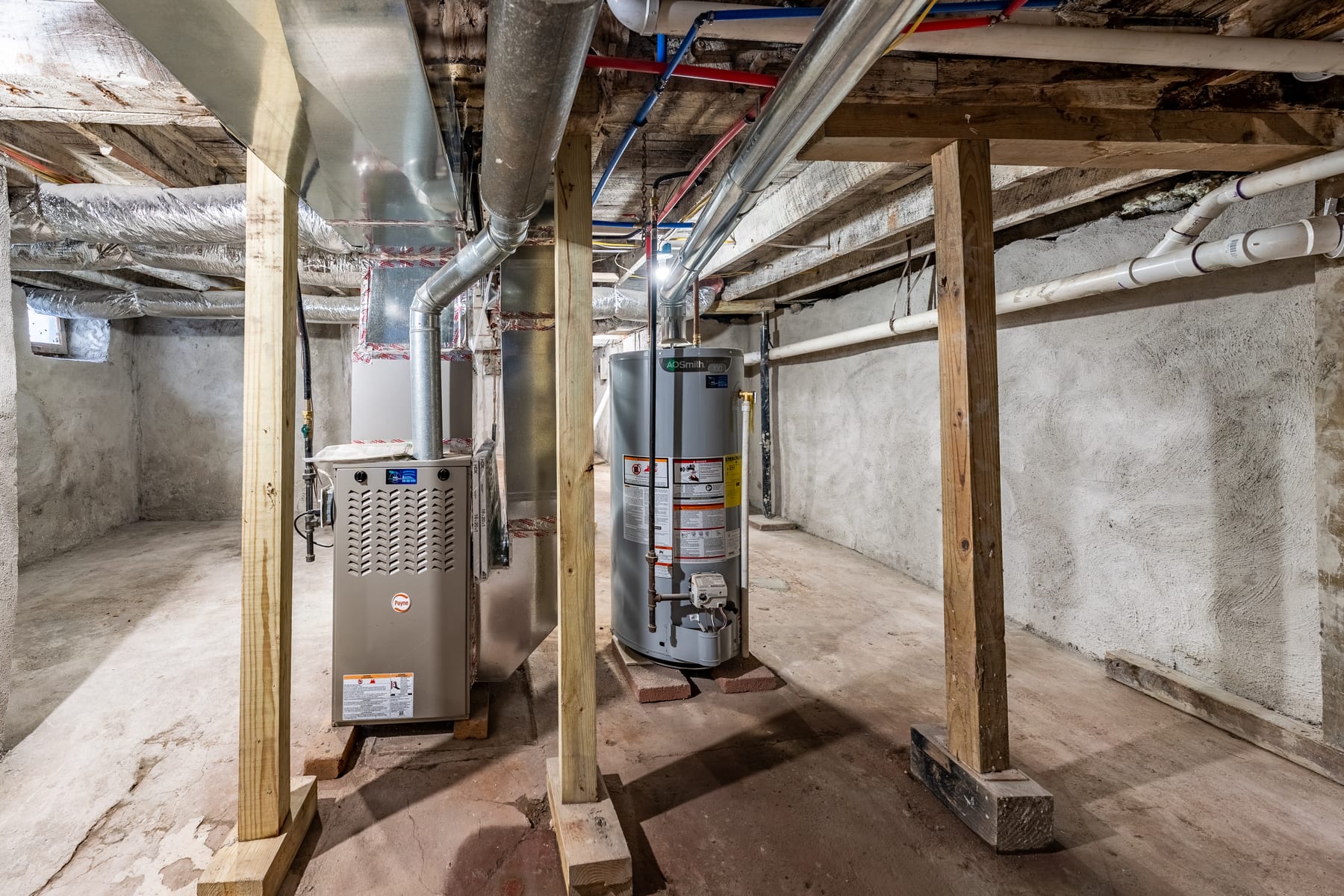 Clean tankless water heater install with color-coded PEX by Rays Clearflow